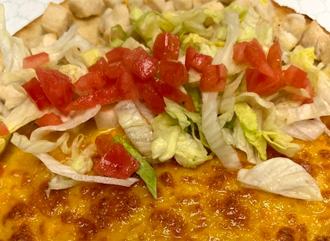 Fresh ingredients pictured on a taco from Primo's Pizza, the best lunch in Johnstown, PA